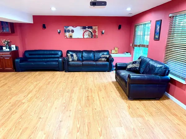 Basement rec room with daylight windows and seating