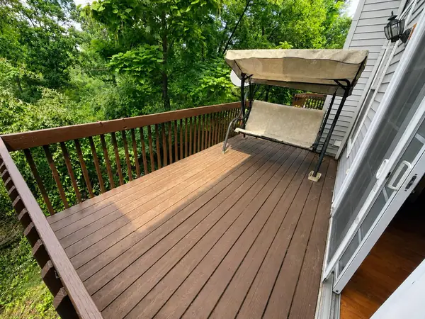 Large deck overlooking peaceful wooded nature views