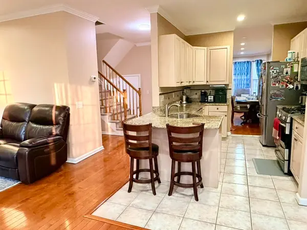 Kitchen open to the breakfast area and staircase