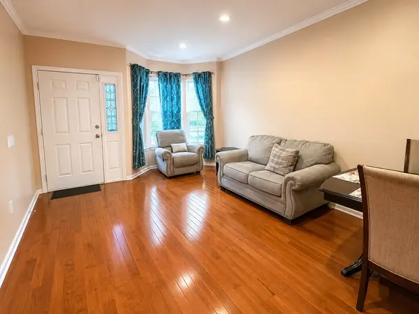 Living room by the front entry with hardwood floors