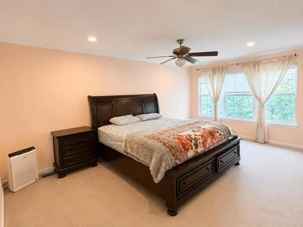 Primary bedroom with bright windows